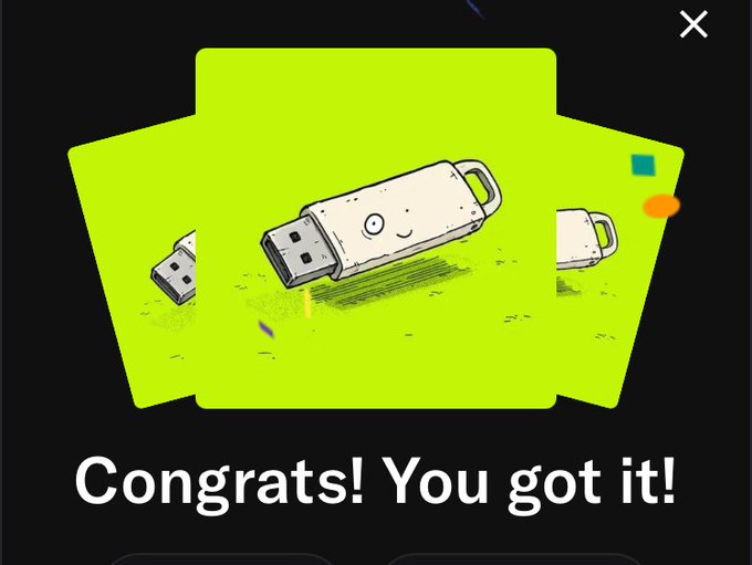 A green 'Congrats! You got it!' reward screen featuring an illustrated USB drive character with a smiling face.