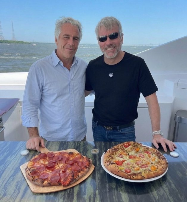 Two men stand on a boat with pizzas in front of them, one holding a pepperoni pizza on a wooden board while the other poses next to a vegetable pizza, with a coastal skyline visible in the background. The image humorously suggests Michael Saylor's enthusiasm for Bitcoin mirrors a passion for pizza.