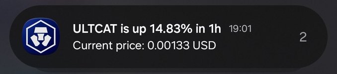A crypto price notification displaying 'ULTCAT is up 14.83% in 1h' with a current price of '0.00133 USD' at 19:01.