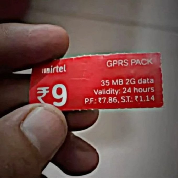A hand holds an Airtel GPRS PACK voucher priced at ₹9, offering 35 MB 2G data with a validity of 24 hours.