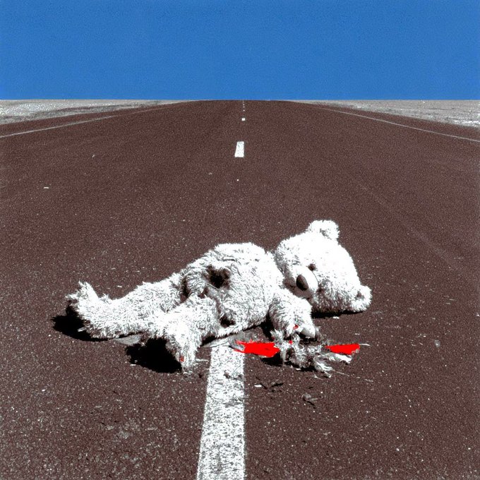 A pair of weathered, well-loved teddy bears lie discarded on an empty highway, bearing the visible markings "WS" and serving as a poignant visual representation of the "wear and tear bear" gifted to the user. The image's symbolism of abandonment and the passage of time mirrors the heartfelt sentiment behind the thoughtful present shared between community members.