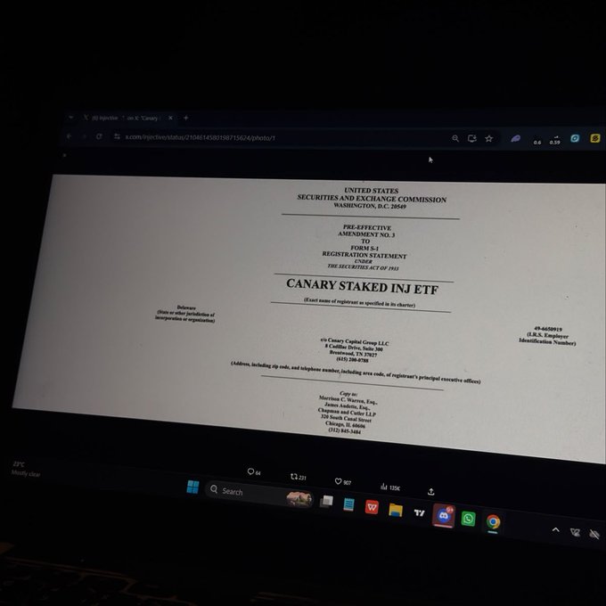 A laptop screen displays a SEC Form S-1 Pre-Effective Amendment No. 3 Registration Statement for the "CANARY STAKED INJ ETF," filed by Canary Capital Group, LLC on July 8, 2025, aligning with the post about Canary's amended filing for a staked INJ ETF that would hold spot INJ and stake 90% of its holdings.