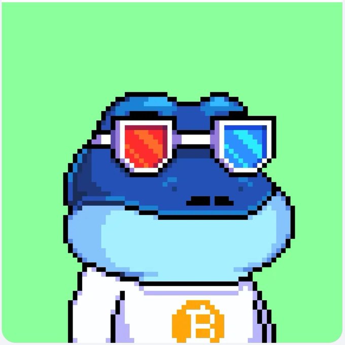 Pixel art style mascot of a blue frog wearing red and blue 3D glasses and a white Bitcoin t-shirt against a green background.