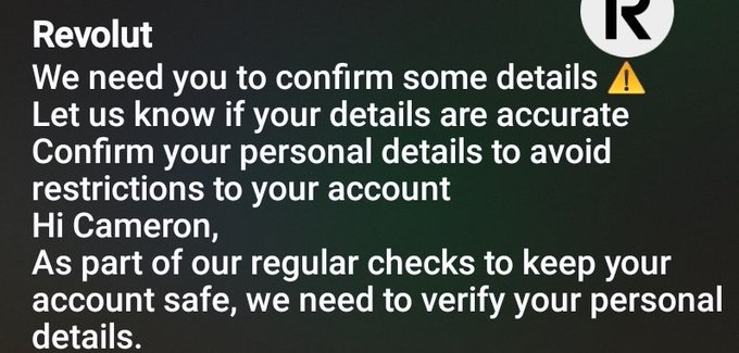 A screenshot of a text message from 'Revolut' warning the user 'Cameron' about verifying personal details with a yellow warning emoji to avoid account restrictions.