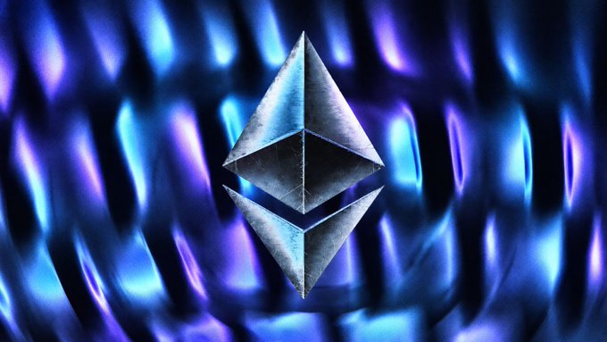 A digital rendering of the Ethereum cryptocurrency logo, featuring a 3D metallic symbol against a vibrant blue and purple abstract background.