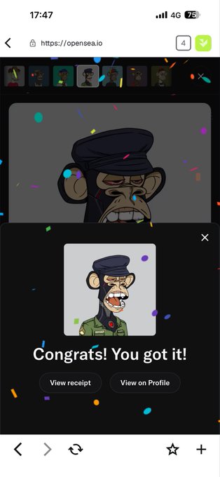 A mobile screenshot of an NFT minting on opensea.io, showing a cartoon monkey in a military cap with the text 'Congrats! You got it!' and confetti effects.