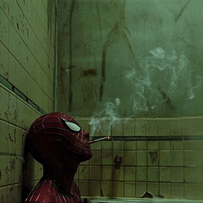 A cinematic shot of Spider-Man in his red and blue suit leaning against a tiled wall, smoking a cigarette as smoke rises into the dimly lit, greenish room.