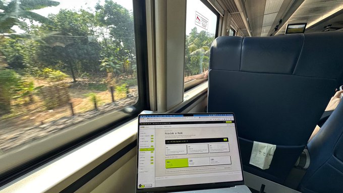 A laptop displays a dashboard for "Provide a Node" as the user works from a train seat, embodying the post's theme of shipping startup work from anywhere—no office required.