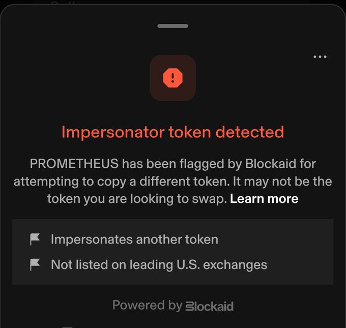 A Blockaid warning screen on a mobile device displays 'Impersonator token detected' for PROMETHEUS, flagging it for impersonating another token and not being listed on leading U.S. exchanges.