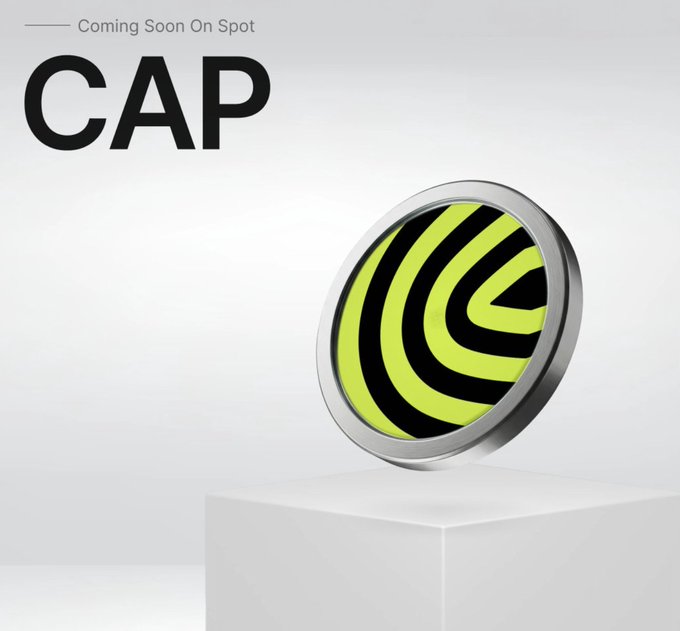 A promotional graphic for the $CAP token, featuring a silver-bordered coin with a neon green and black striped design displayed on a white pedestal, with "Coming Soon On Spot" text above the bold "CAP" ticker. The image visually supports the announcement of Cap Labs Limited's upcoming $CAP token campaign on Bybit.