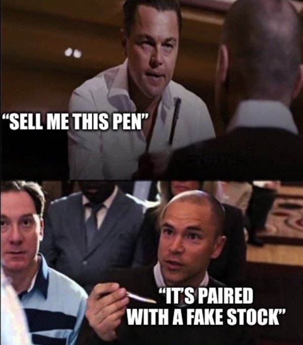 A two-panel meme featuring the iconic "Sell Me This Pen" scene from *The Wolf of Wall Street*. The top panel shows Leonardo DiCaprio asking "SELL ME THIS PEN," while the bottom panel shows Jordan Belfort (played by Jonah Hill) responding "IT'S PAIRED WITH A FAKE STOCK," humorously connecting the classic sales pitch scene to the crypto/wallstreetbets meme culture of pairing hyped stock pitches with dubious assets—a fitting "gm" (good morning) joke for traders.