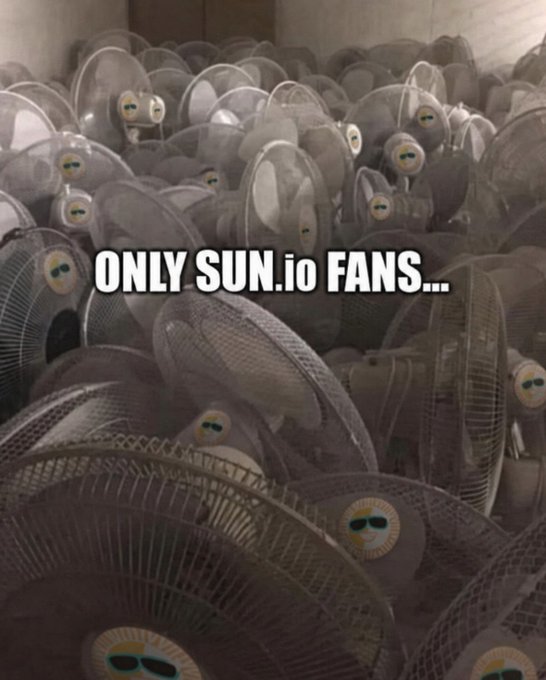 A large pile of dusty, unused electric fans fills the frame, with overlaid text reading "ONLY SUN.io FANS..."