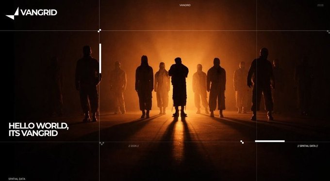 A dark, cinematic promotional image for VANGRID featuring silhouettes of figures in hooded clothing standing in an orange-lit environment with the tagline 'HELLO WORLD, ITS VANGRID'.