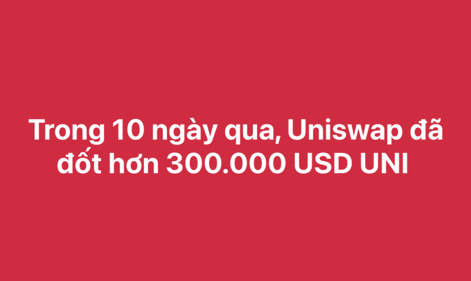 A red screen with white text in Vietnamese stating 'Trong 10 ngày qua, Uniswap đã đốt hơn 300.000 USD UNI' (In the past 10 days, Uniswap has burned over 300,000 USD UNI).