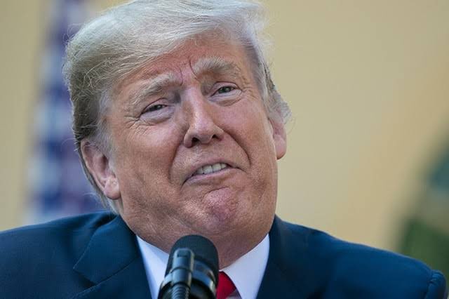 His Excellency President Trump is pictured speaking into a microphone, with the text "$TRUMP was released before this was decided, so it's safe, you know" from the post likely referencing his legal situation.