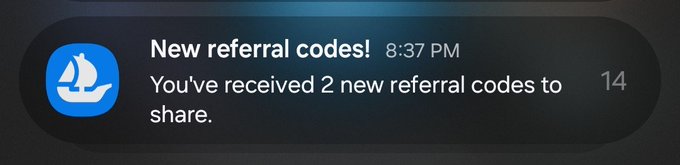A mobile notification from the OpenSea app reading 'New referral codes! 8:37 PM - You've received 2 new referral codes to share.'