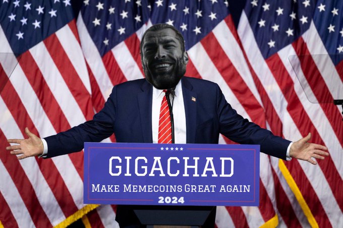 A satirical political meme showing a figure in a suit and red striped tie with a black-and-white 'Gigachad' face photoshopped on, standing at a podium reading 'GIGACHAD - MAKE MEMECOINS GREAT AGAIN 2024' in front of American flags.
