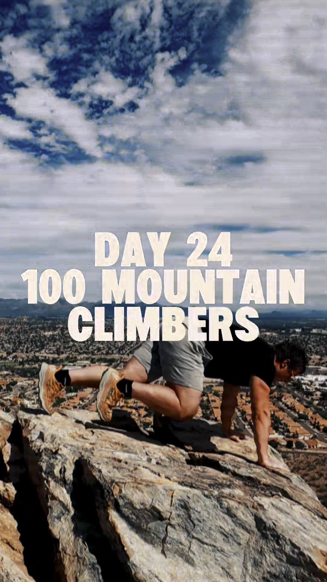 A man performs mountain climbers exercise on a rocky cliff edge overlooking a city, with text reading 'DAY 24 100 MOUNTAIN CLIMBERS'.