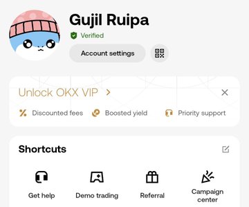 A mobile app interface showing an account page for 'Gujil Ruipa' (Verified) on what appears to be OKX, with options to unlock OKX VIP benefits including discounted fees and boosted yield.