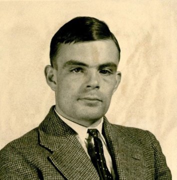 A vintage sepia-toned portrait photograph of a young man wearing a textured suit jacket, white shirt, and a dark patterned tie.