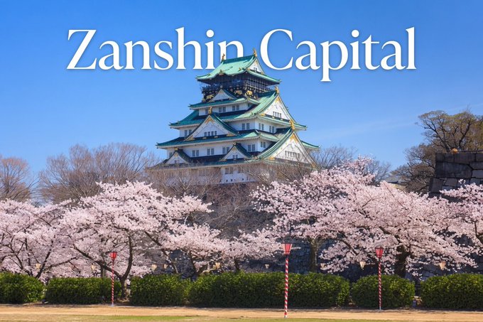 A Japanese castle framed by cherry blossoms displays the text "Zanshin Capital" in elegant white lettering. The image visually reinforces the post's mention of Zanshin as a leading web3 VC firm, lending an air of strength, tradition, and prestige to the endorsement of $TOESCOIN.
