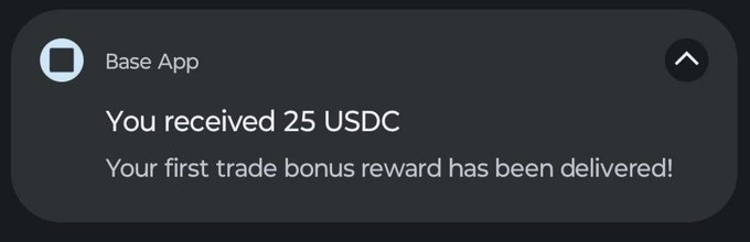 A Base App notification announces the delivery of a 25 USDC first trade bonus reward, with a collapse arrow in the top-right corner. The image illustrates the post's message about Base App user rewards, specifically showing the $25 USDC reward tier being delivered to users who completed an eligible swap.