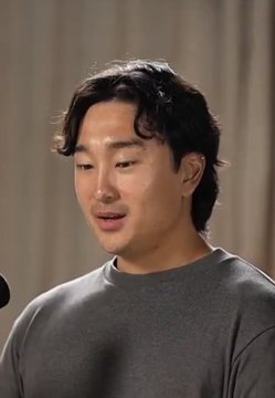 An Asian man with medium-length dark hair, wearing a gray t-shirt, speaks into a microphone, likely during an interview or podcast appearance. The image accompanies a post criticizing the $LIBRA insider trading situation, suggesting he is discussing the controversial early distribution of tokens to known insiders.