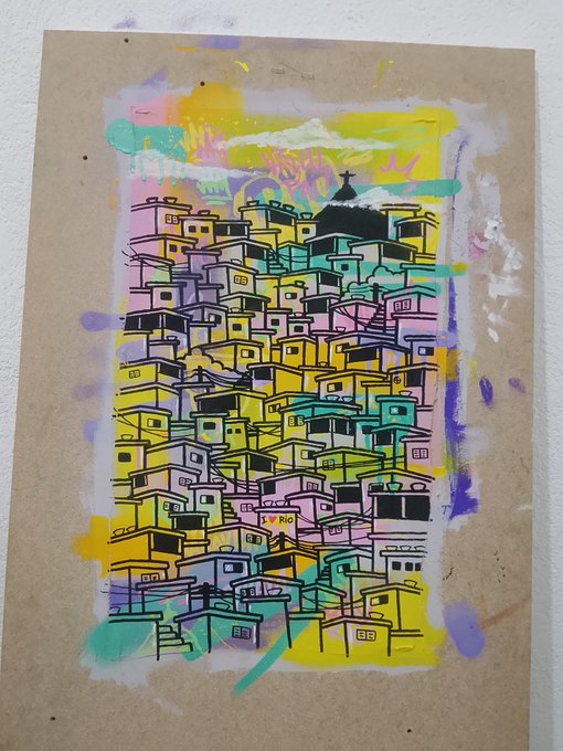 A colorful, stylized street art painting depicting a densely packed hillside favela neighborhood in pink, yellow, teal, and purple tones on brown paper.