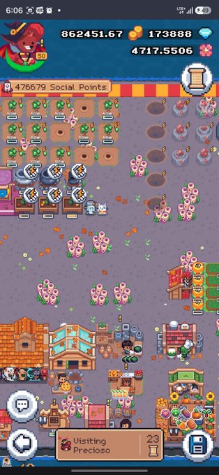 A screenshot of a mobile farm management game displaying various crops, pink flowers, buildings, in-game currency counters at the top, and a notification reading '476679 Social Points'.