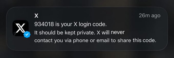 A screenshot of an X (Twitter) login notification with text reading '934018 is your X login code. It should be kept private. X will never contact you via phone or email to share this code.' marked as received 26m ago.