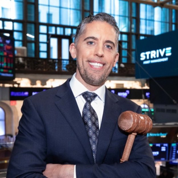 This image shows the CEO of Strive Asset Management, holding a gavel, with the company's logo visible in the background. This likely represents a significant decision or announcement from the company, aligning with the news of their substantial Bitcoin purchase.