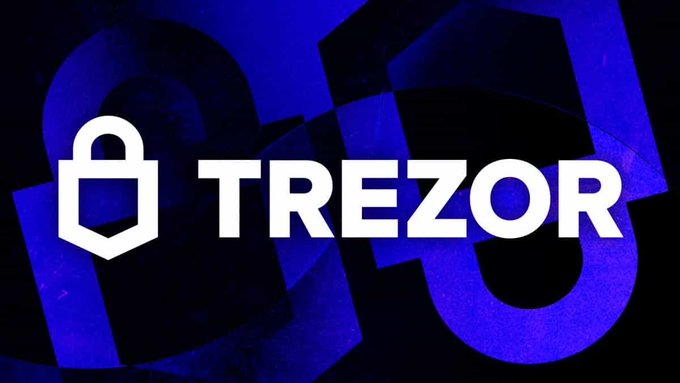 The image shows the white "TREZOR" logo and padlock icon against a dark blue background, visually linking to the post about Trezor's recent data leak that exposed nearly 14,000 customers' personal information, though wallet and private key data remained secure.