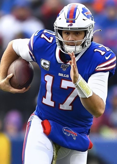 Buffalo Bills quarterback #17, Josh Allen, runs with the football in his right hand during a game. The image visually supports the post's prediction market wager about whether Allen will score a rushing touchdown against Detroit.