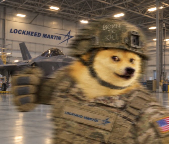 A humorous edited image of a Shiba Inu dog wearing military gear with a 'LOCKHEED MARTIN' patch, 'BORN TO KILL' written on its helmet, standing in front of a Lockheed Martin hangar with a fighter jet.