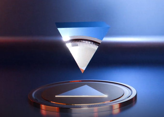 A futuristic 3D rendering of an inverted blue and silver cone-shaped object hovering above a circular platform, with light beams crossing the scene.