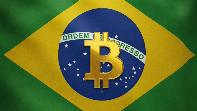 The Brazilian flag with a golden Bitcoin '₿' symbol superimposed over the central blue globe, set against the green and yellow diamond design.