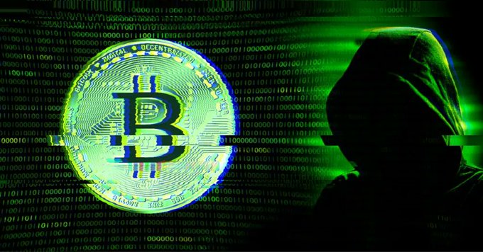 A stylized image shows a hooded figure silhouetted in green against a background of binary code, standing next to a glowing Bitcoin (B) coin.