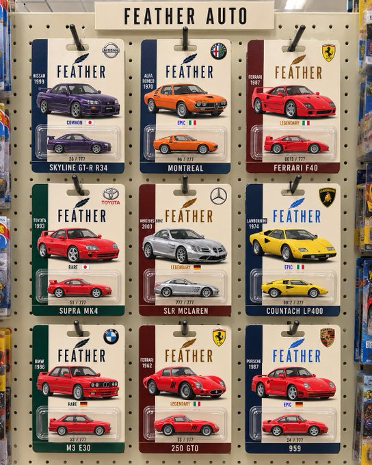A retail display labeled 'FEATHER AUTO' showcases a collection of miniature toy cars in packaging featuring classic models like Skyline GT-R R34, Ferrari F40, and Porsche 959.