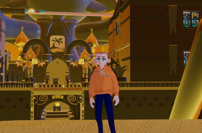 A 3D animated character wearing an orange hoodie and a gold crown stands in an ornate, golden palace-like room.