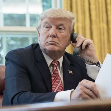 President Trump is pictured on the phone, seemingly in discussion about the USA's World Cup match against Belgium, as per the accompanying post. The image visually represents the claim made in the text.