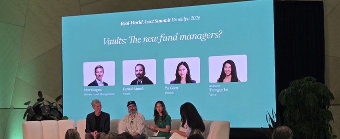 A panel discussion at the 'Real-World Asset Summit Brooklyn 2026' on a screen titled 'Vaults: The new fund managers?', featuring headshots and names of speakers including 'Matt Hougan', 'Patrick L. Murck', 'Pei Chen', and 'Moderator: Theresa Le', with panelists seated on stage below.