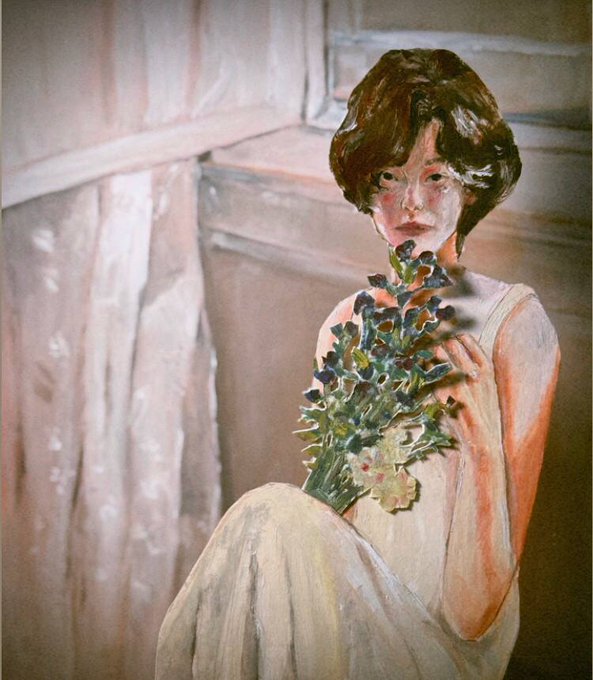The image features a woman sitting down with her hands around a bouquet of flowers, possibly holding a painting or an oil painting depicting a woman. The painting has a vintage style, giving it a classic appeal. The woman's position suggests that she is seated in front of a window, which adds to the overall composition and atmosphere of the scene.