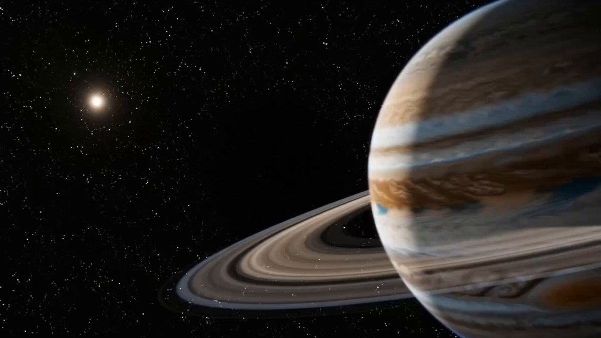 The image shows a planet with brown and blue colors against a black background of stars. The planet appears to be in space, possibly near the sun or another celestial body. The star visible in the top left corner of the image is brighter than the rest of the sky, making it stand out prominently.