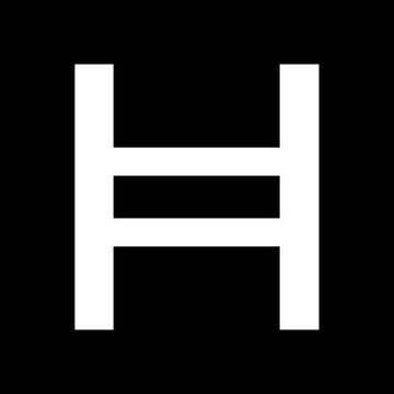 The image displays the white logo for Hedera, a stylized 'H', against a black background. This visual corresponds to the text discussing a partnership where McLaren F1 adopts Hedera's principles of trust, innovation, and precision.