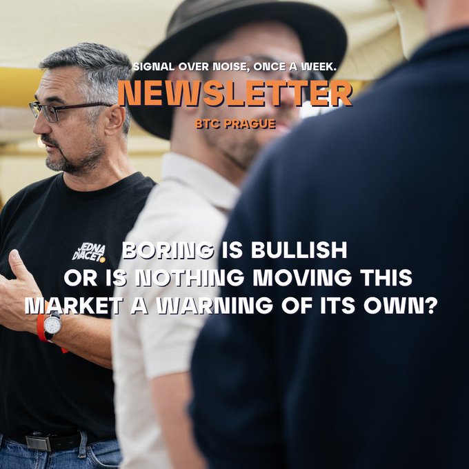 A newsletter cover from BTC Prague titled "NEWSLETTER" with the tagline "SIGNAL OVER NOISE, ONCE A WEEK," featuring a photo of men in conversation and headline text "BORING IS BULLISH OR IS NOTHING MOVING THIS MARKET A WARNING OF ITS OWN?"