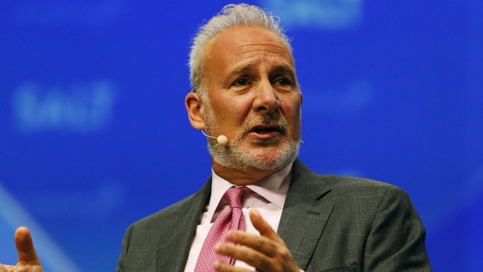 Peter Schiff, a well-known gold advocate and Bitcoin critic, speaks at a conference while wearing a headset microphone and gesturing with his hand, fitting the post's context of him advising investors to sell Bitcoin and rotate into gold.