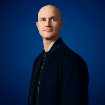 A bald man in a dark jacket poses against a deep blue background, looking thoughtfully off-camera. The image appears to be a professional headshot that accompanies a breaking news quote urging U.S. Democrats to pass the Bitcoin Clarity Act to bring market structure regulations in line with other G20 economies.