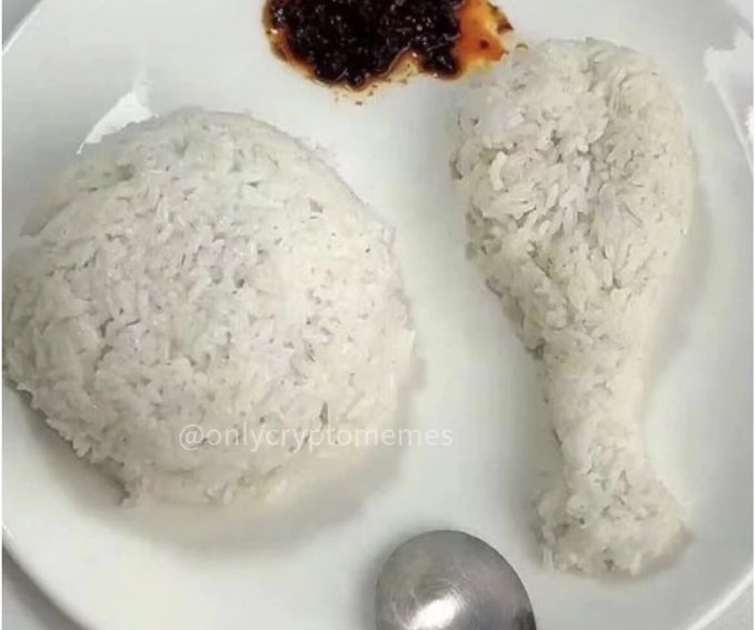 The image shows a plate of food consisting of two different types of rice, one white and one brown. A spoon is placed next to the plate, ready for use. The caption reads "Dinner. Thank you crypto." This suggests that the meal might be related to cryptocurrency or digital currency in some way.