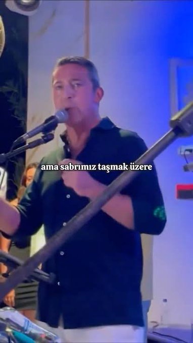 A man in a dark shirt sings into a microphone on stage, with the Turkish text "ama sabrımız taşmak üzere" (meaning "but our patience is about to overflow") overlaid on the image. The caption's message about impatient critics waiting to pounce on any misstep aligns with the Turkish text's warning about reaching a breaking point with patience.