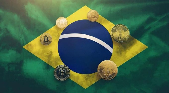 A graphic showing the Brazilian flag with several physical Bitcoin coins placed on top of it, set against a green-toned background.